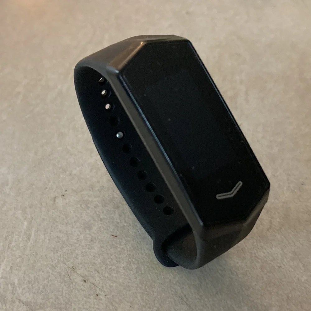 Kore Fitness Tracker. Tracker, charger, and three extra wrist bands.